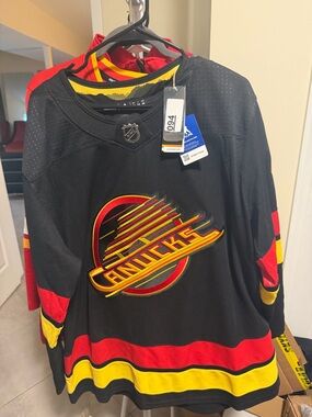 NHL Vancouver Canucks Black Jersey with Red & Yellow Trim